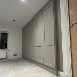 6 door shaker style wardrobe fitted in Leeds hanging and long hanging space by New Creation Joinery closed square