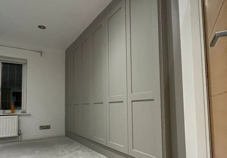 6 door shaker style wardrobe fitted in Leeds hanging and long hanging space by New Creation Joinery closed square
